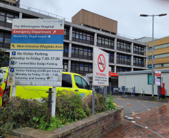 a picture of a sign at the front of a hospital. It says that there is no visitor parking from 7:00-17:00