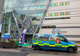a brightly coloured ambulance with cartoons of characters from Peter Pan on the outside